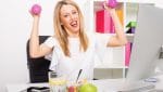 Happy woman in office being active